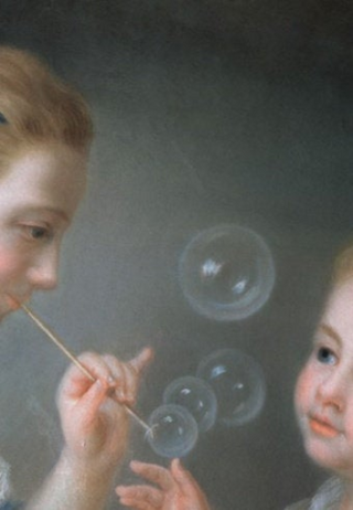 A woman blows bubbles for a small child.

She smiles as the young one reaches to pop the bubbles that lazily drift upwards.